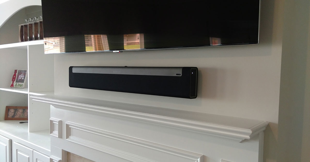 and Sonos Playbar Mounted Over Fireplace